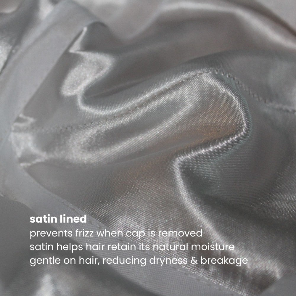 Close-up of the satin lining inside the Miae Beige Satin-Lined Cap, with text highlighting its benefits: preventing frizz, retaining moisture, and reducing breakage while maintaining a stylish, face-flattering fit.