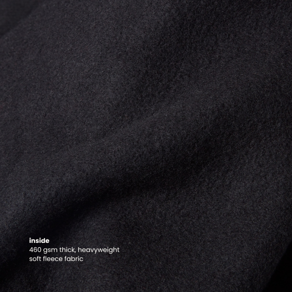 Close-up of the 460gsm thick fleece fabric of the Miae Black Hoodie, offering warmth, comfort, and a soft feel for everyday wear.