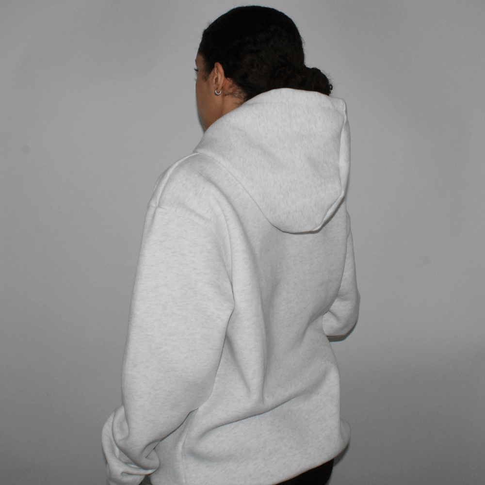 Back view of the Miae Light Grey Marl Satin-Lined Hoodie on a model, displaying the flattering cut and satin-lined hood for hair protection.