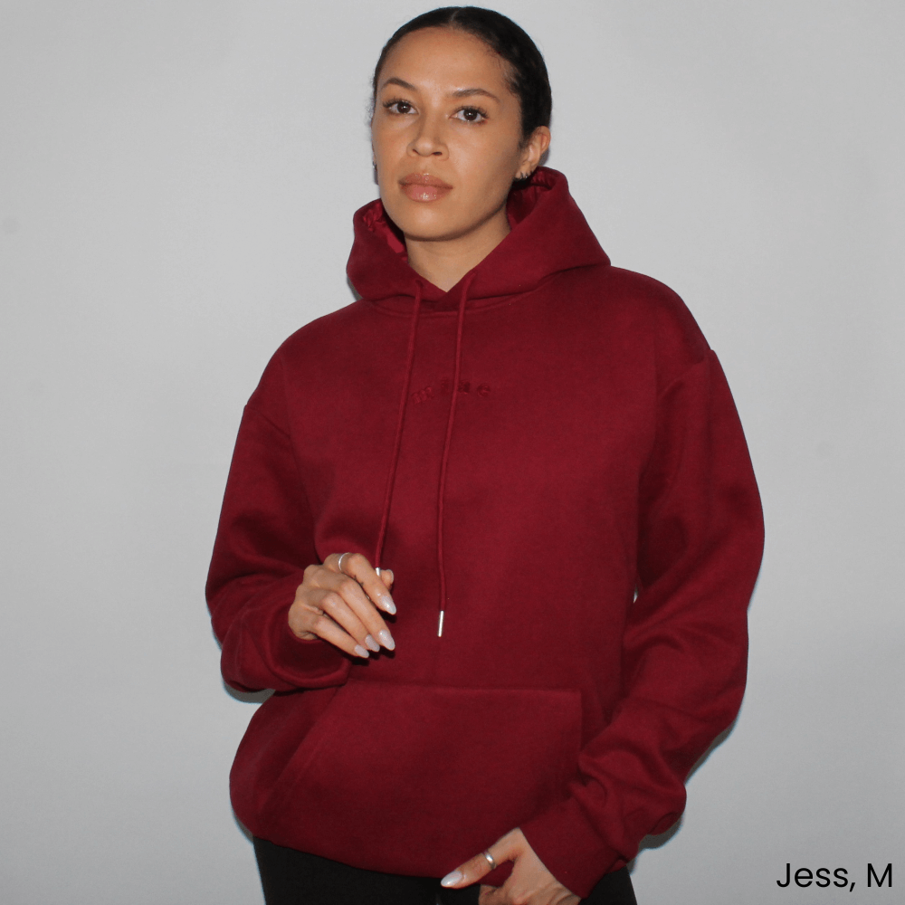 Model wearing the Miae Maroon Satin-Lined Hoodie, featuring a stylish fit and satin-lined hood that helps prevent frizz and breakage.