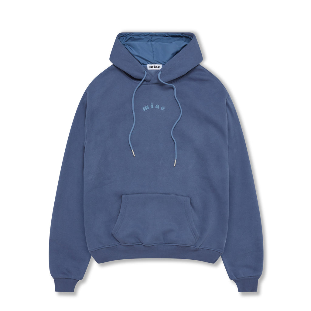 Flat lay of the Miae Washed Blue Satin-Lined Hoodie, featuring a soft, thick fleece and a satin-lined hood that protects hair from frizz and breakage.