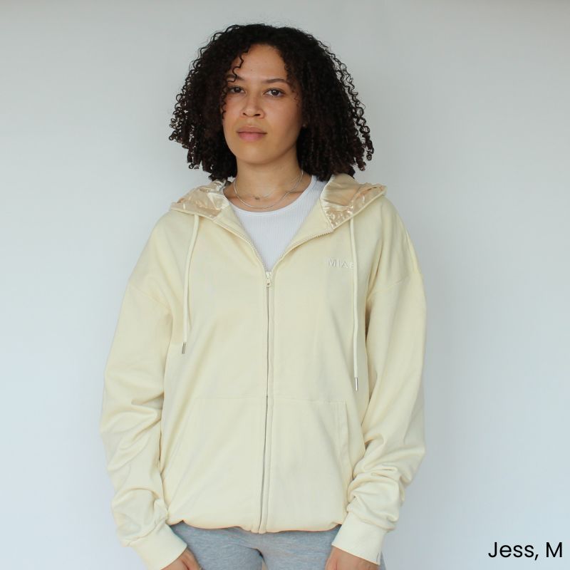 Model wearing the Miae Beige Satin-Lined Zip Hoodie, showing a casual fit with a curl-friendly satin-lined hood
