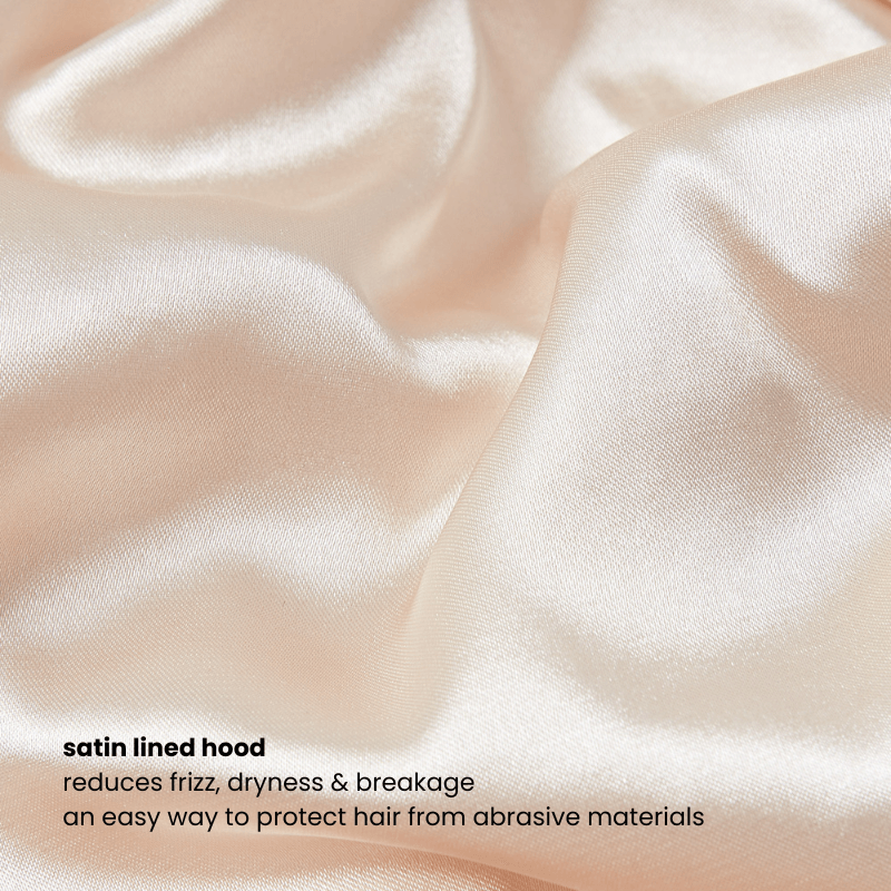 Close-up of satin lining inside the beige zip hoodie’s hood, designed to protect hair from frizz and dryness