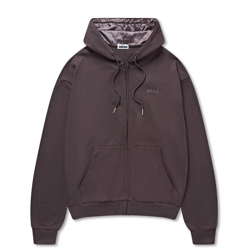 Flat lay of the Miae Charcoal Satin-Lined Zip Hoodie, showcasing the deep neutral tone and satin-lined hood that protects curly and natural hair